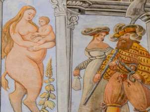 Historical facade painting of a witch.