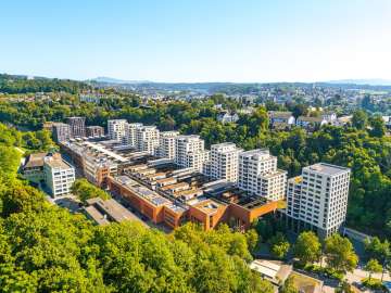 A view from above of the steel foundry. Modern apartment buildings stand alongside the former industrial site.