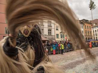 Schaffhausen carnival parade with witch A carnival parade. The focus is on a witch in disguise.