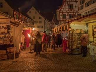 Medieval market Stein am Rhein There are many market stalls between the historic alleyways of the small town of Stein am Rheins. Visitors in medieval garb wander through the market.