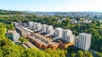 A view from above of the steel foundry. Modern apartment buildings stand alongside the former industrial site.
