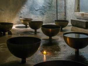 Various larger bowls in a cellar.