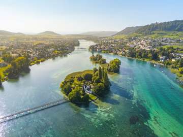 View from above of the island of Werd, the turquoise-colored Rhine and the town of Stein am Rhein.