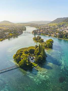 View from above of Werd Island, the turquoise Rhine, and the town of Stein am Rhein.