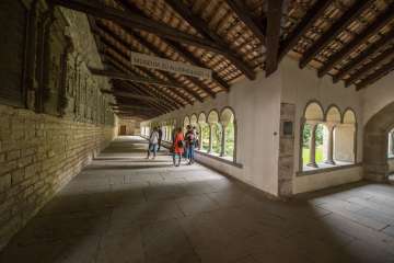 Guided tour of the old town of Schaffhausen. Group and guide standing in the cloister of Allerheiligen Schaffhausen.